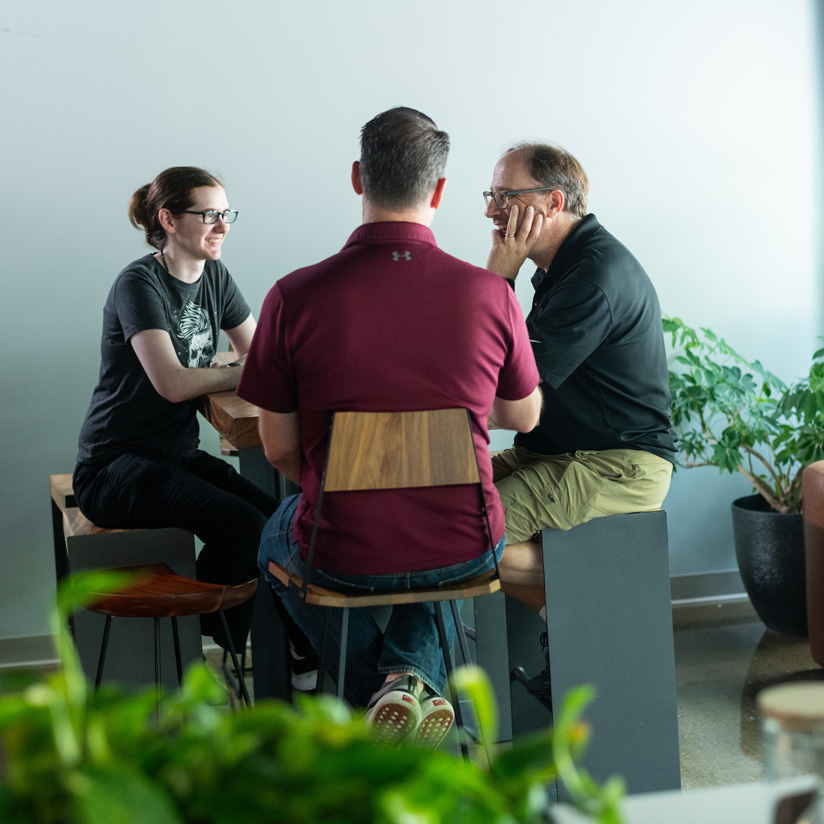 NuHarbor employees at a table