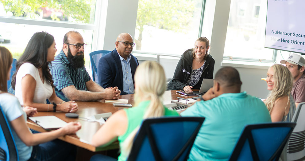 a group of people at a NuHarbor Security new hire orientation