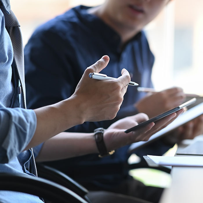 Two people sitting at a desk collaborating