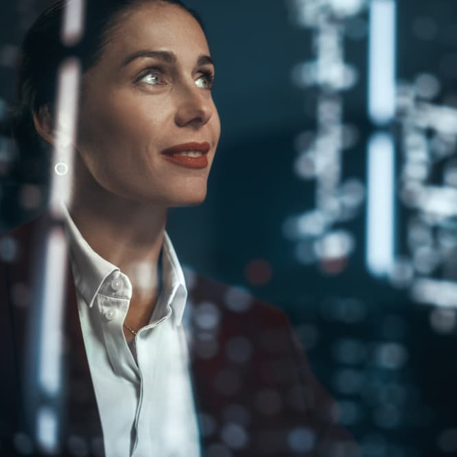 Woman looking up at technology. 